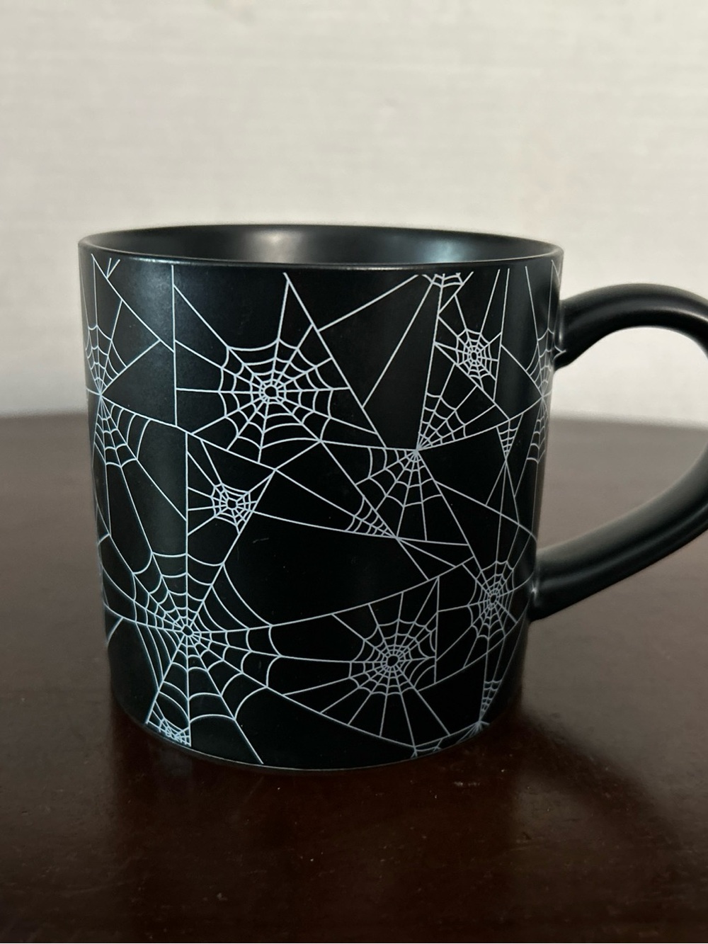 Hyde & Eek Matte Black Ceramic Mug with White Spiderweb Design